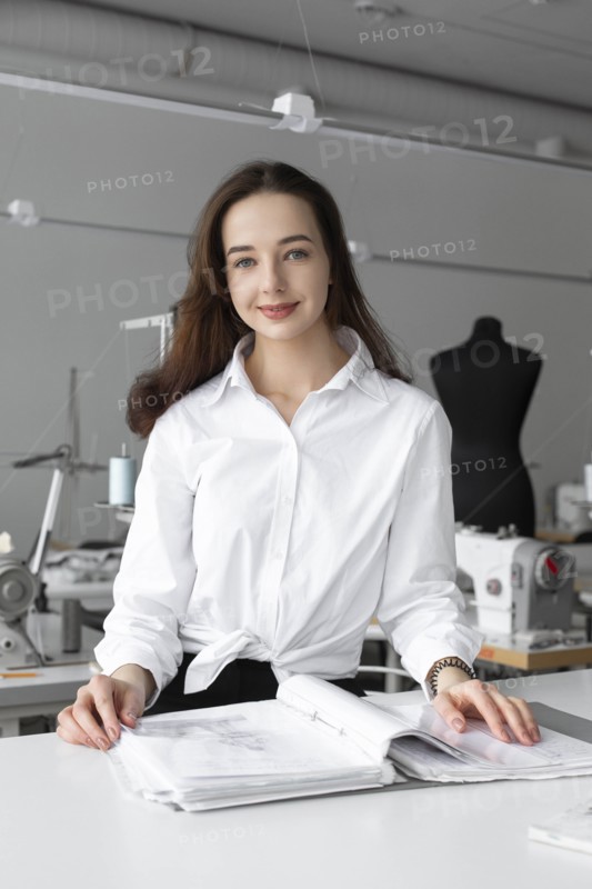 Fashion designer working at desk in studio