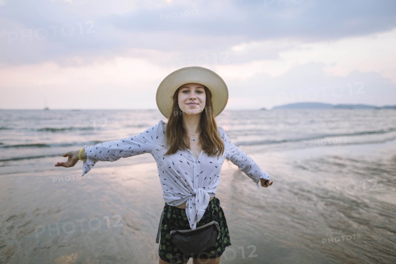 Young woman in sun hat on beach in Krabi, Thailand