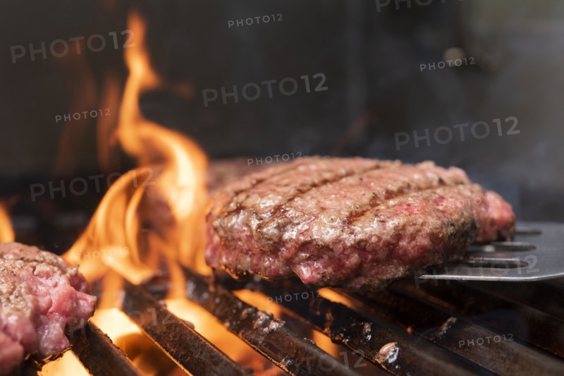 Hamburger patty on barbecue grill
