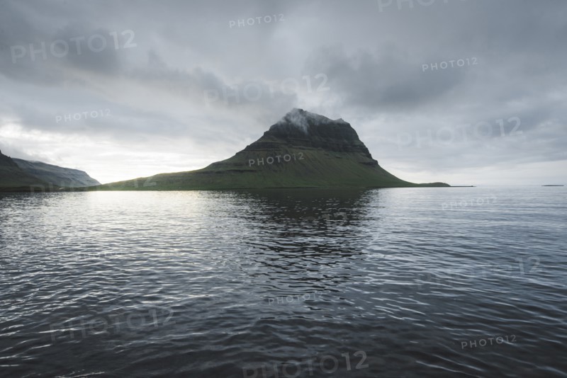 Kirkjufell under overcast sky in Iceland