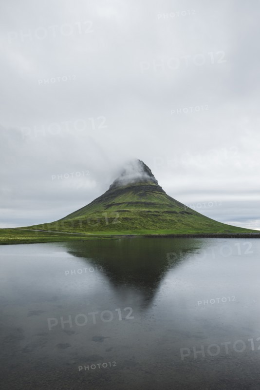 Kirkjufell under overcast sky in Iceland