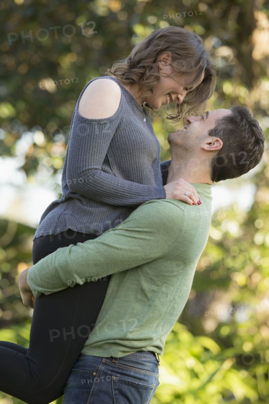 Man lifting young woman