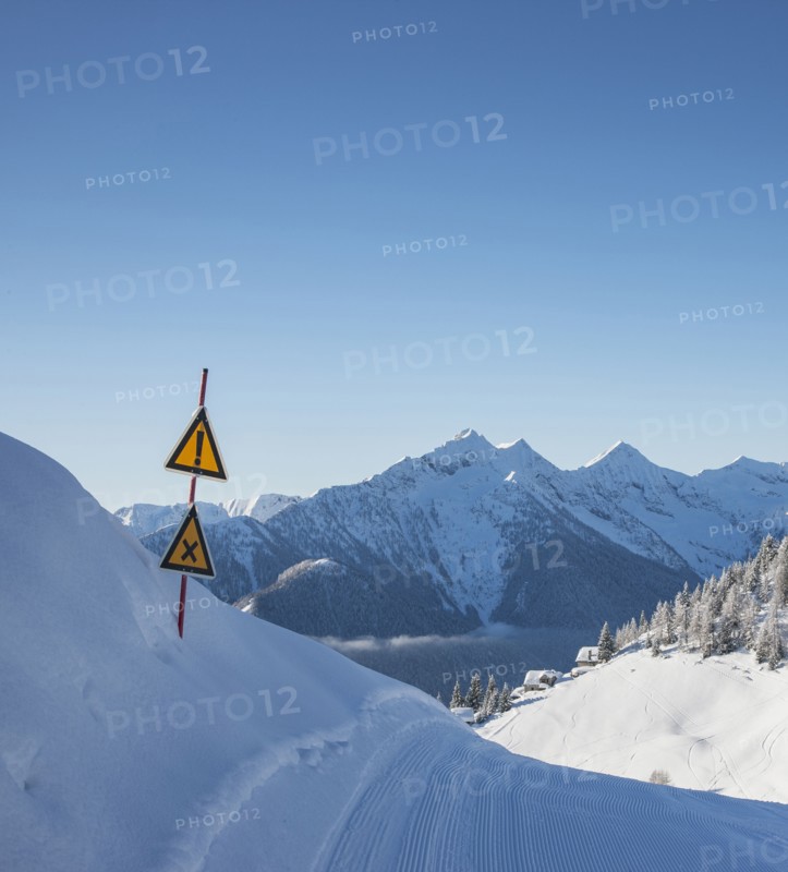 Warning signs on ski track in Piedmont, Italy