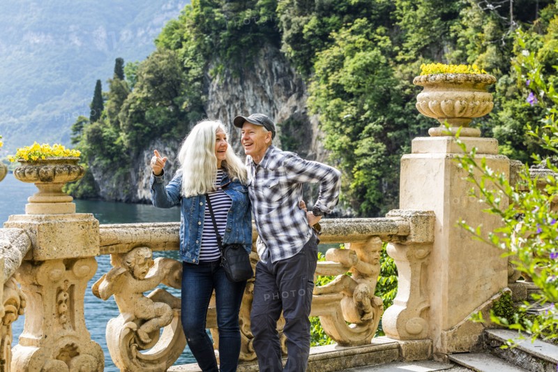 Smiling couple at Villa del Balbianello by Lake Como, Italy