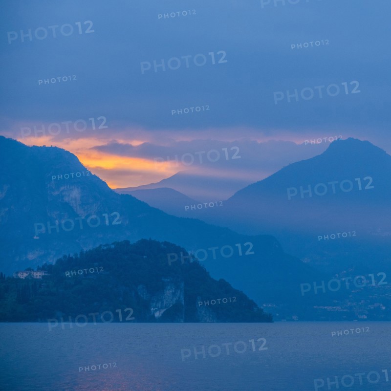 Sunset sky over mountains by Lake Como, Italy