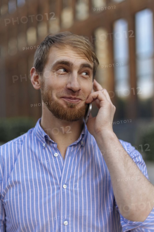 Bearded man on phone call