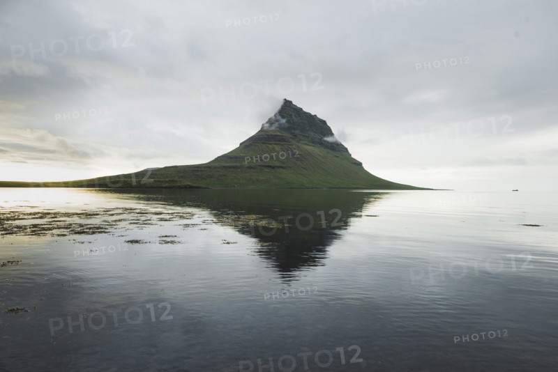 Kirkjufell under overcast sky in Iceland