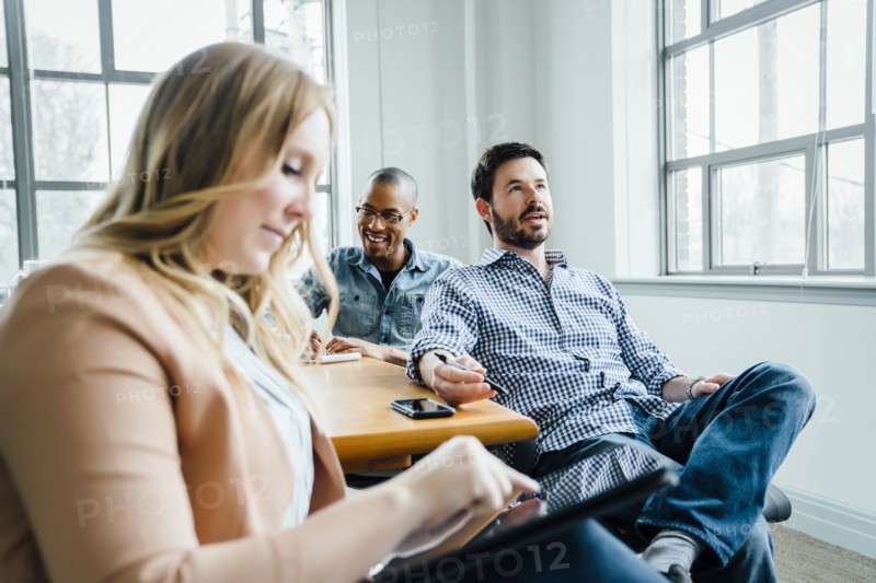 Coworkers in board room during meeting