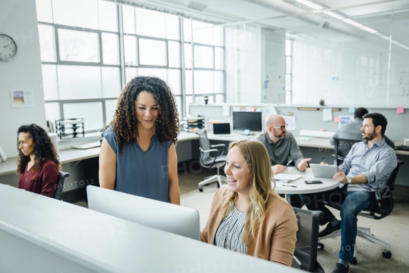 Women using computer in office