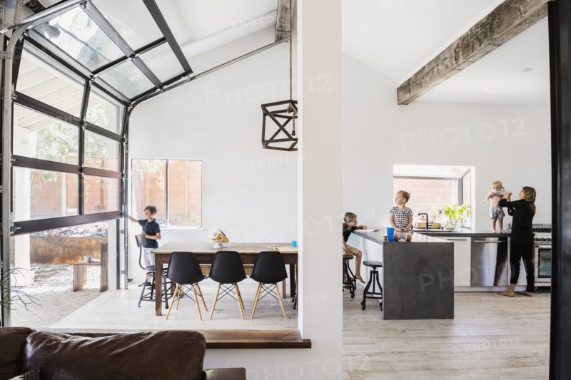 Mother and children in kitchen and dining room