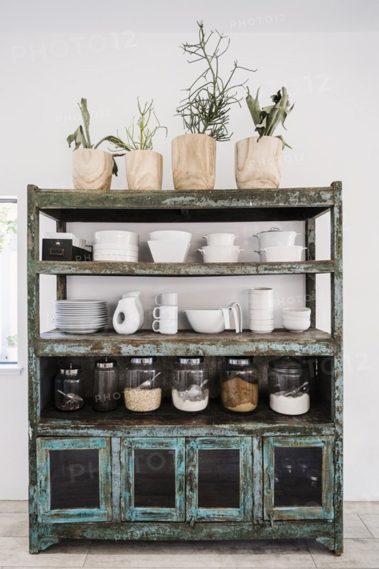 Worn shelves holding tableware