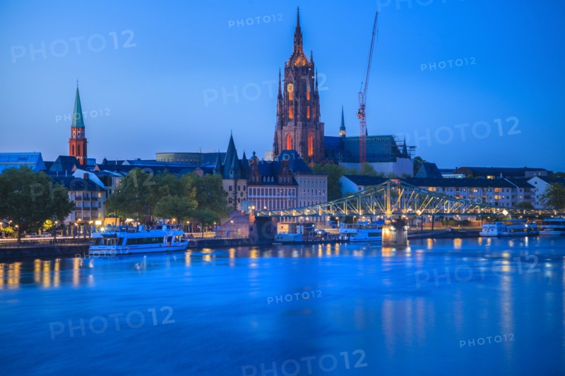 Cathedral by river at sunset in Frankfurt