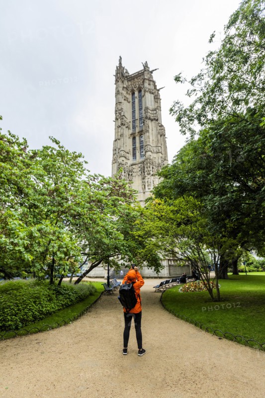 Woman photographing tower in Paris