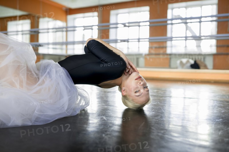 Ballet dancer practicing on studio floor