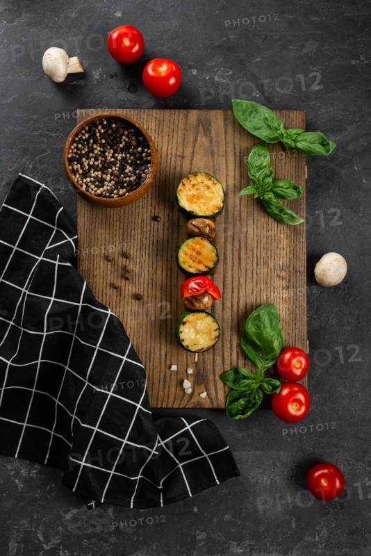 Grilled mushroom and courgette skewer on cutting board