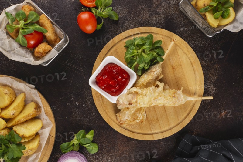 Deep fried food with tomato sauce
