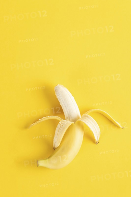 Banana on yellow surface