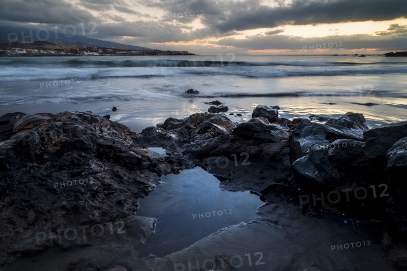 Rocks on beach at sunset in Tenerife