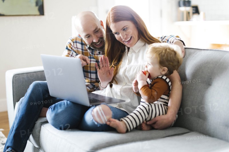 Family using laptop to video chat