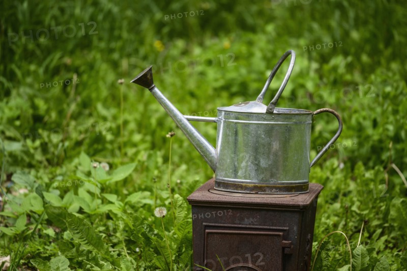Watering can on old stove