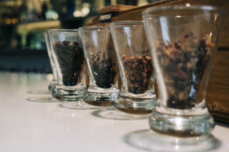 Row of glasses containing spices