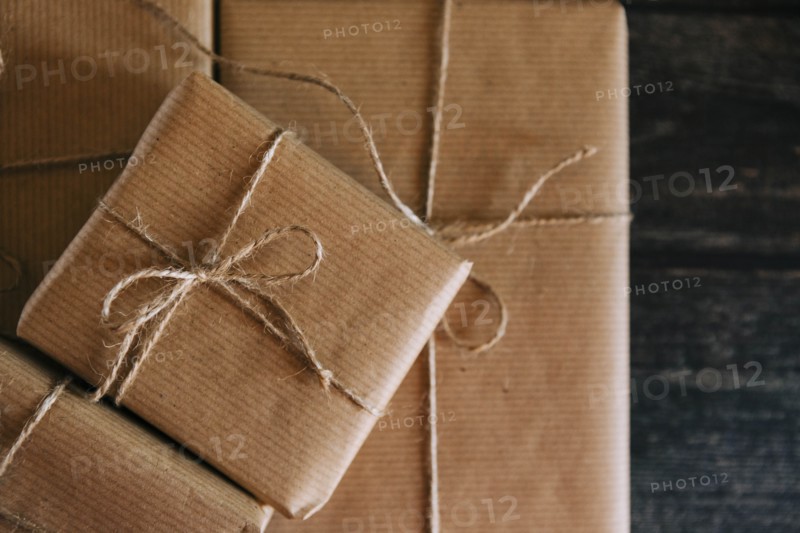 Presents wrapped in brown paper and string