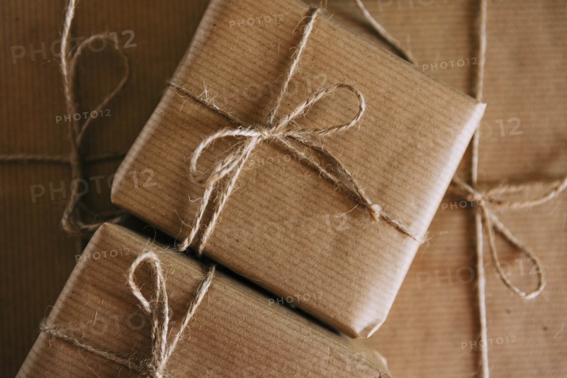 Presents wrapped in brown paper and string