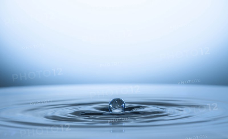 Water drop creating circular ripples