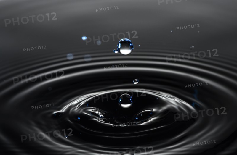 Water drop creating circular ripples