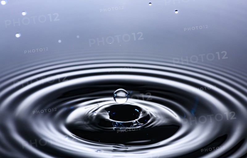 Water drop creating circular ripples
