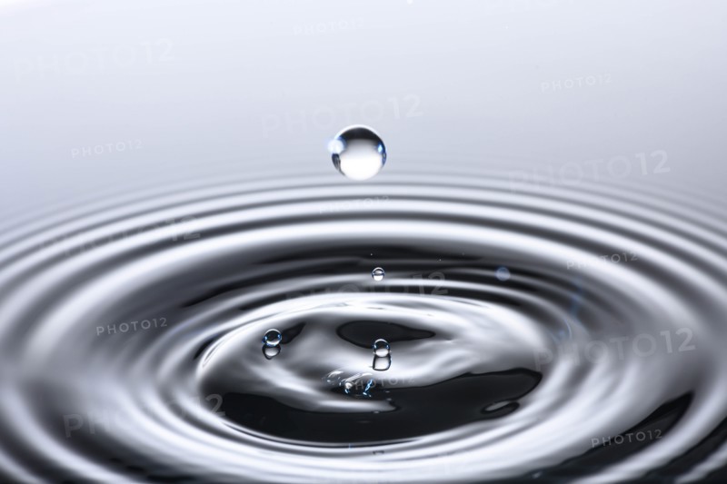 Water drop creating circular ripples