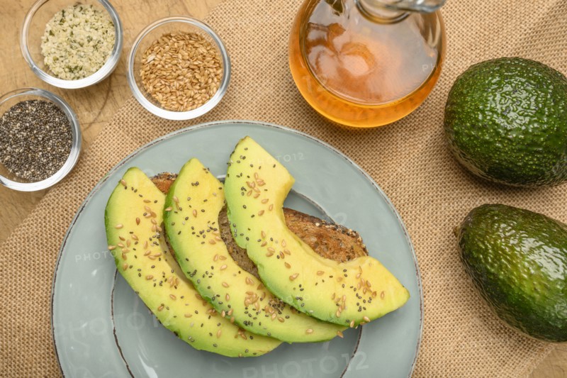 Sliced avocado on toast with seeds