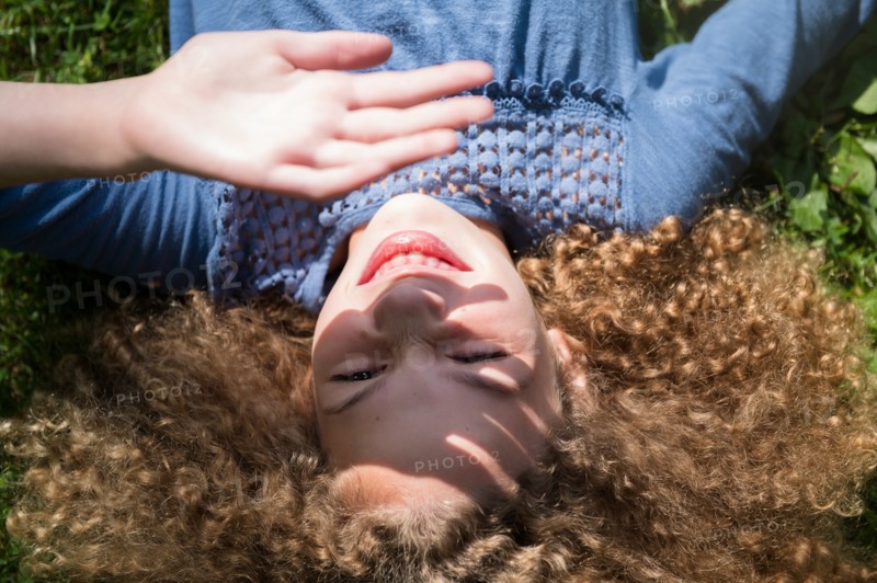 Girl shielding her eyes
