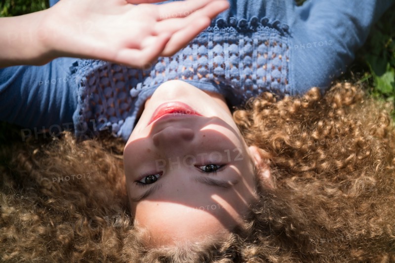 Girl shielding her eyes