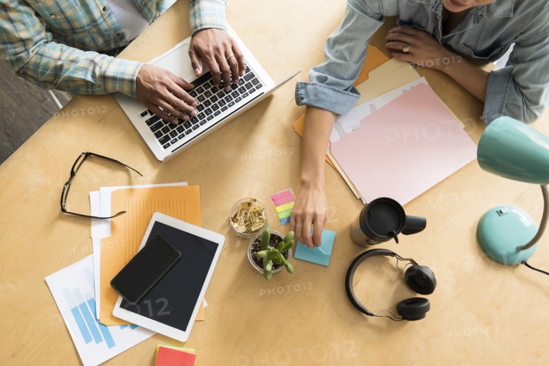 Coworkers working at office desk