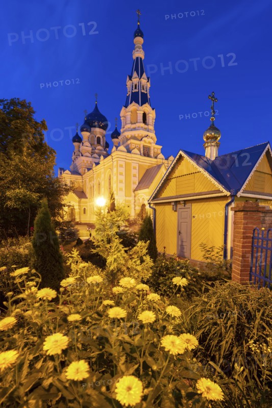 Flowers by St. Nicholas Church at night in Brest, Belarus