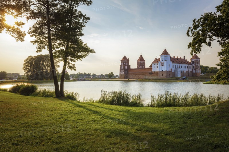 Lake by Mir Castle at sunset in Mir, Belarus