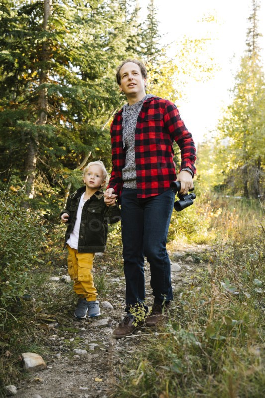 Father and son in forest