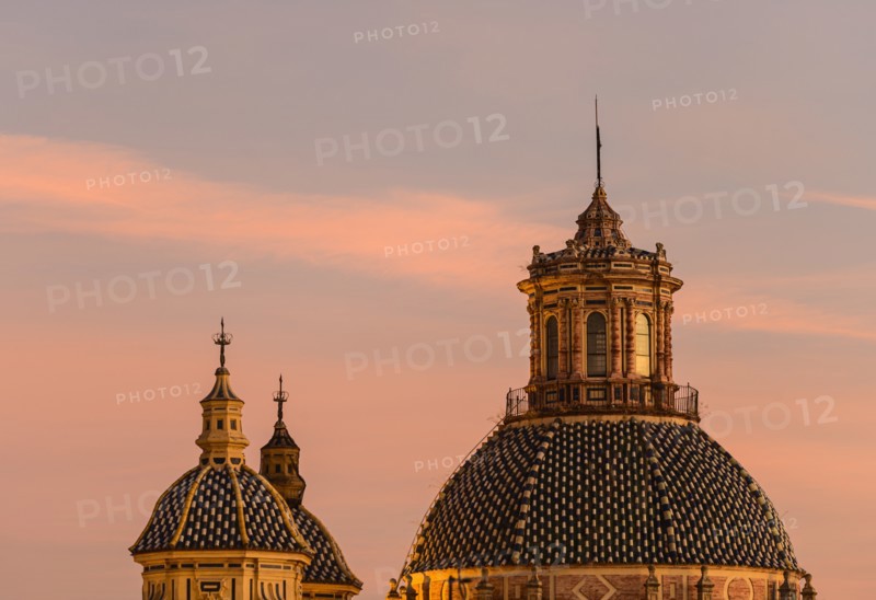 Domes of Church of Saint Louis of France at sunset in Seville, Andalusia, Spain
