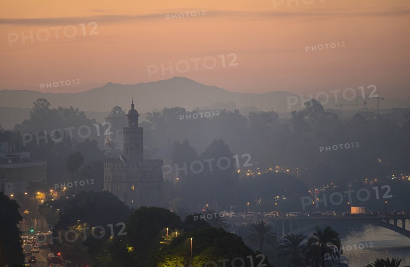 Cityscape with Torre del Oro at sunset in Seville, Andalusia, Spain