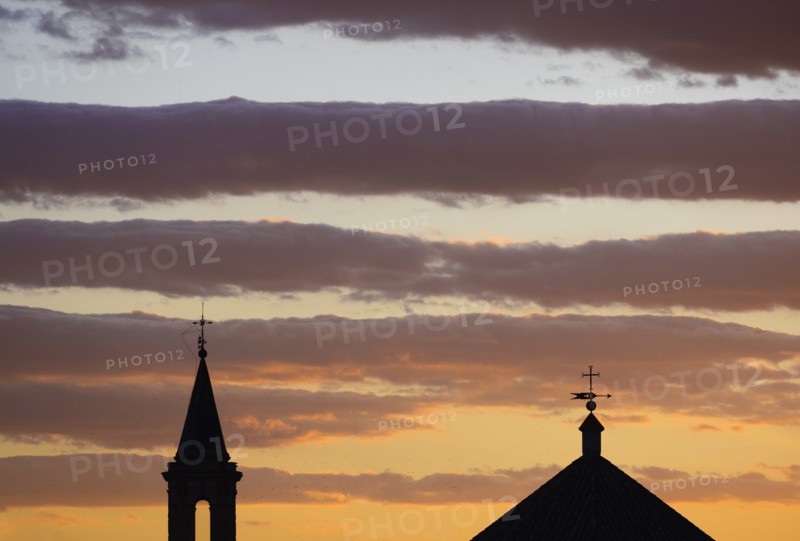 Silhouette of church roof and spire at sunset in Seville, Andalusia, Spain