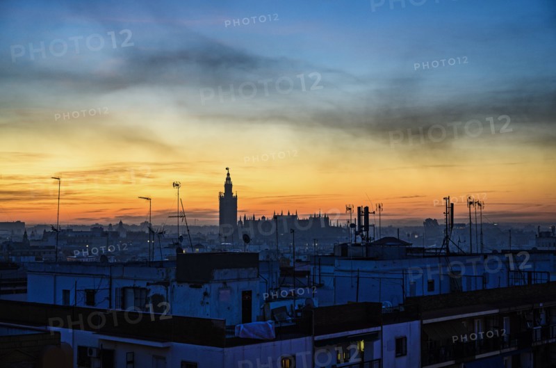 Cityscape with Seville Cathedral at sunrise in Seville, Andalusia, Spain