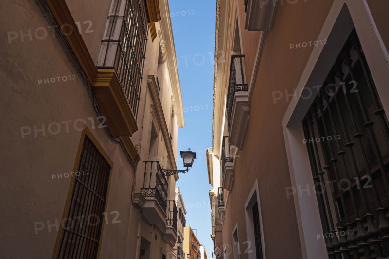 Low angle shot of townhouses in Seville, Andalusia, Spain