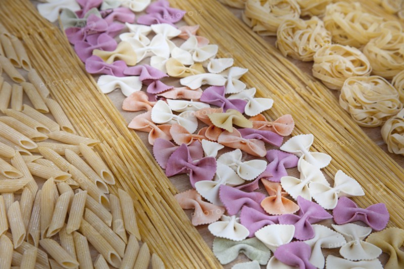 Assorted uncooked pasta in rows