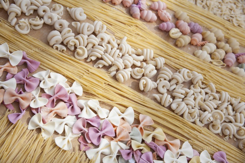 Assorted uncooked pasta in rows