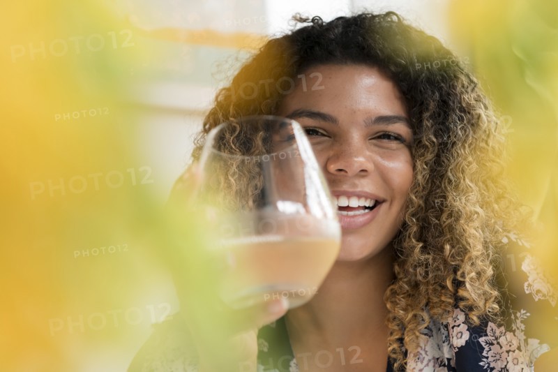 Smiling woman holding drink