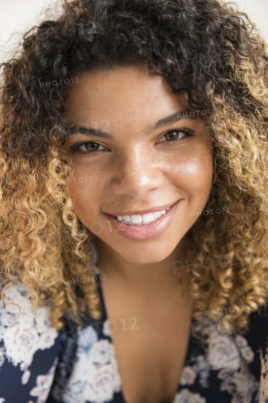 Smiling woman with curly hair