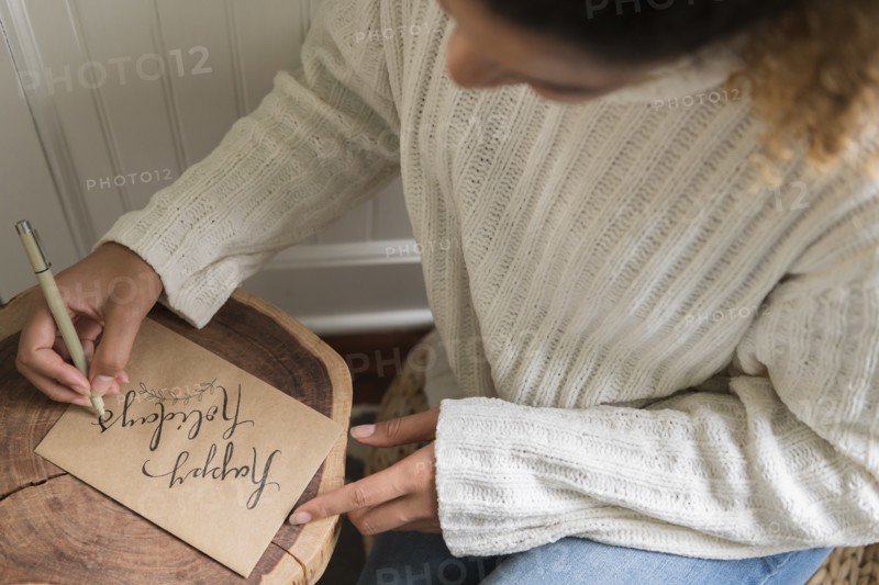 Woman writing on card