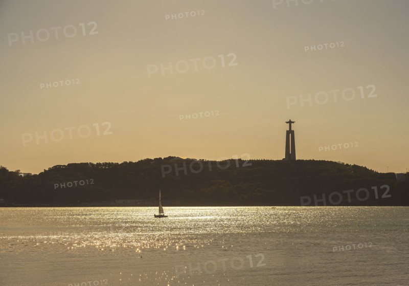 Tagus River with Sanctuary of Christ the King in distance in Lisbon, Portugal