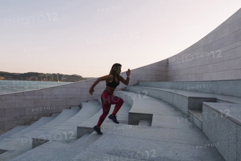 Woman running up steps